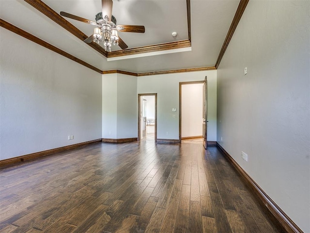 4109 Slate Bridge Rd, Edmond, OK 73034 - empty room featuring ceiling fan, a raised ceiling, dark wood finished floors, and crown molding