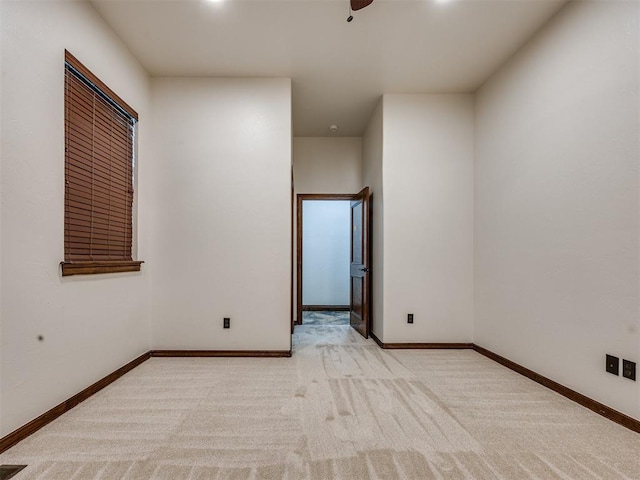 4109 Slate Bridge Rd, Edmond, OK 73034 - spare room featuring light colored carpet and a ceiling fan