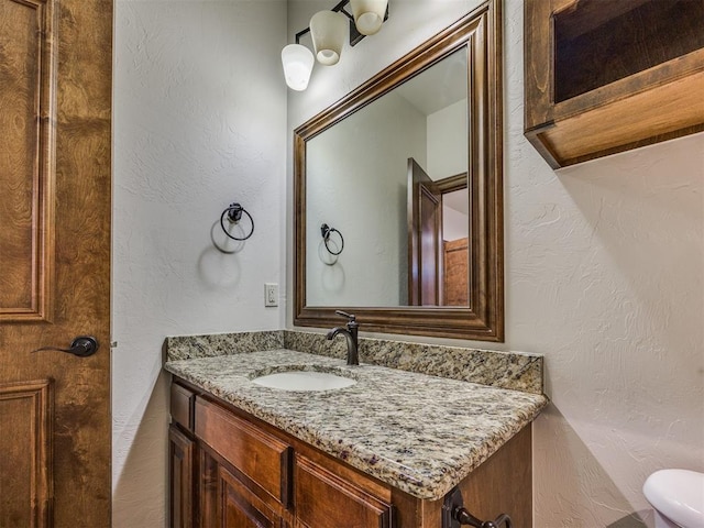 4109 Slate Bridge Rd, Edmond, OK 73034 - bathroom featuring vanity and a textured wall