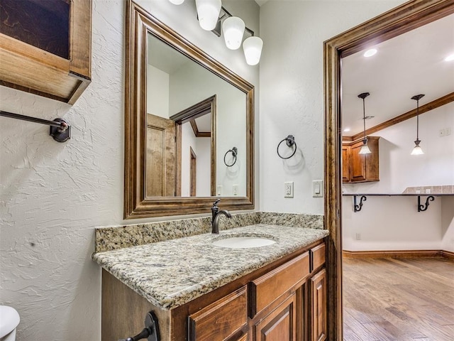 4109 Slate Bridge Rd, Edmond, OK 73034 - bathroom featuring vanity and wood finished floors