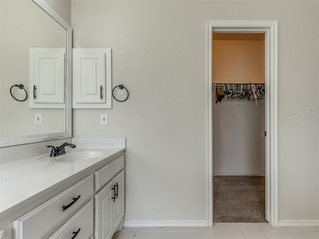 7300 NW 109th St, Oklahoma City, OK 73162 - bathroom with vanity, a walk in closet, and tile patterned floors
