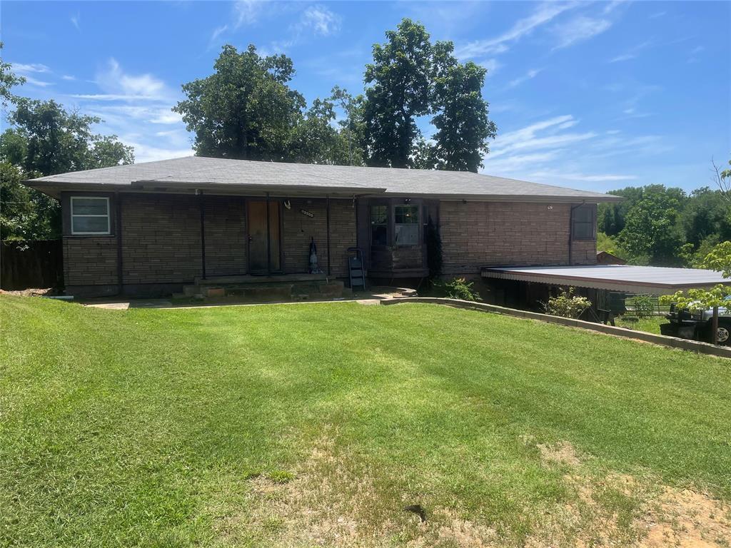 13300 SE 31st St, Choctaw, OK 73020 - view of front facade featuring a front lawn, a porch, and brick siding