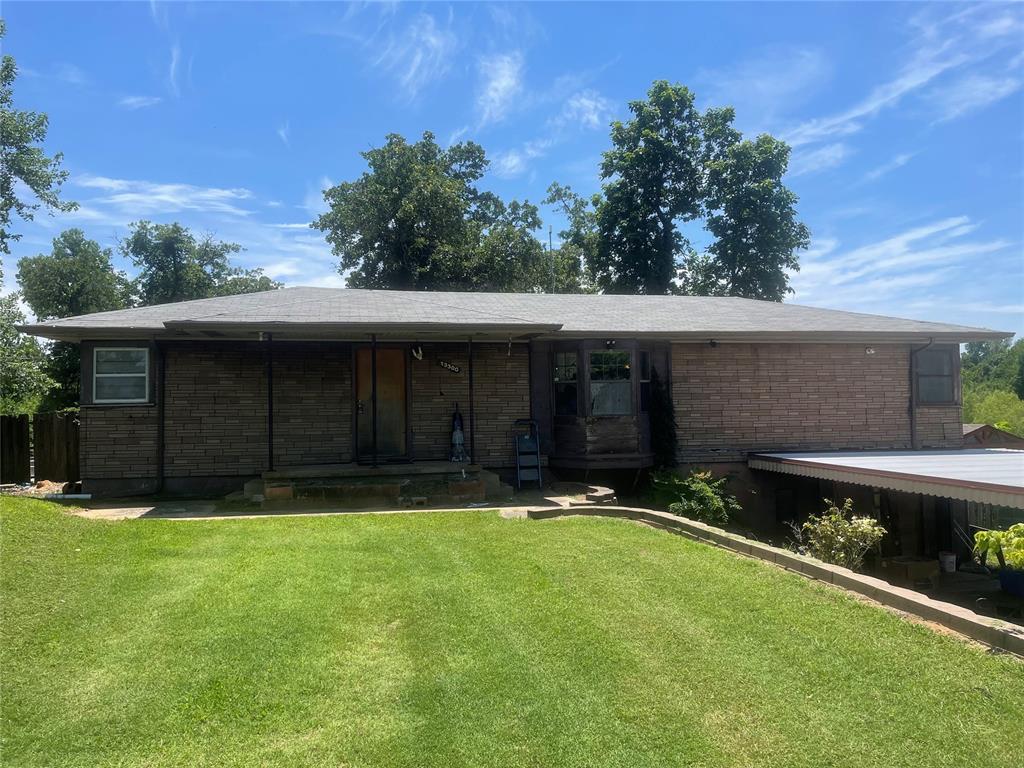 13300 SE 31st St, Choctaw, OK 73020 - single story home with a front yard, brick siding, and a porch