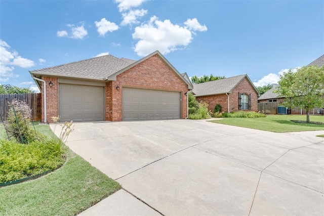 3000 Hampshire Ln, Oklahoma City, OK 73179 - view of front facade with brick siding, a garage, driveway, and roof with shingles