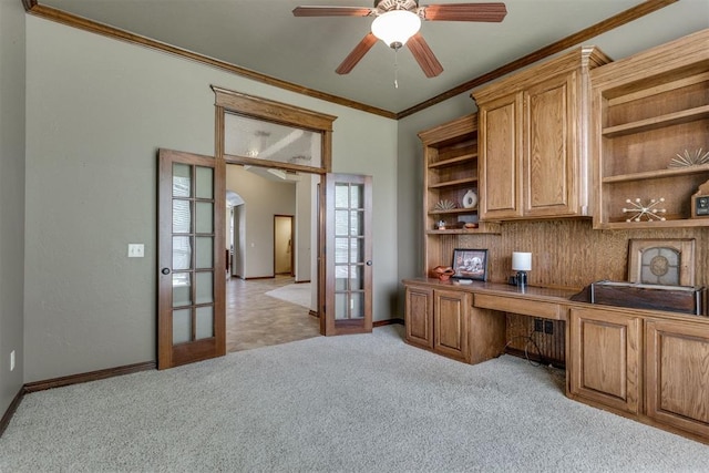 3000 Hampshire Ln, Oklahoma City, OK 73179 - office with french doors, crown molding, light colored carpet, ceiling fan, and built in desk