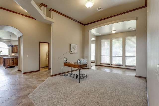 3000 Hampshire Ln, Oklahoma City, OK 73179 - home office with arched walkways, healthy amount of natural light, crown molding, and light tile patterned floors
