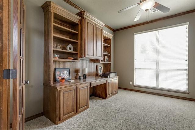 3000 Hampshire Ln, Oklahoma City, OK 73179 - office area featuring built in study area, light carpet, a ceiling fan, and crown molding