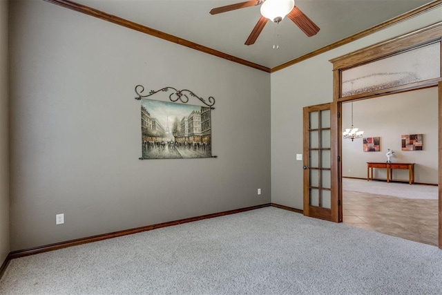 3000 Hampshire Ln, Oklahoma City, OK 73179 - carpeted spare room featuring french doors, crown molding, a ceiling fan, and a chandelier