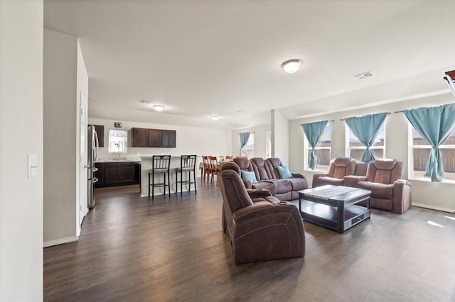 512 SE 3rd Pl, Newcastle, OK 73065 - living room with dark wood-style floors and baseboards
