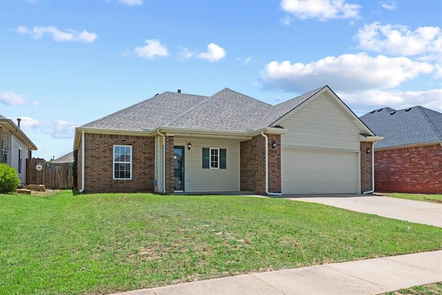 5916 SE 70th St, Oklahoma City, OK 73135 - view of front of house with an attached garage, concrete driveway, brick siding, and roof with shingles