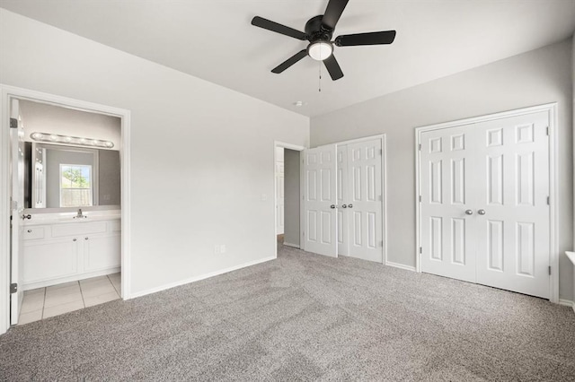 5916 SE 70th St, Oklahoma City, OK 73135 - unfurnished bedroom with two closets, light carpet, ensuite bath, and a ceiling fan