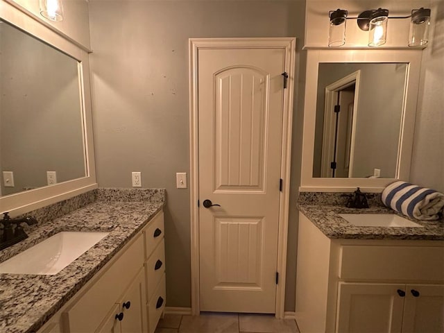 5024 SW 130th St, Oklahoma City, OK 73173 - bathroom featuring two vanities and tile patterned flooring