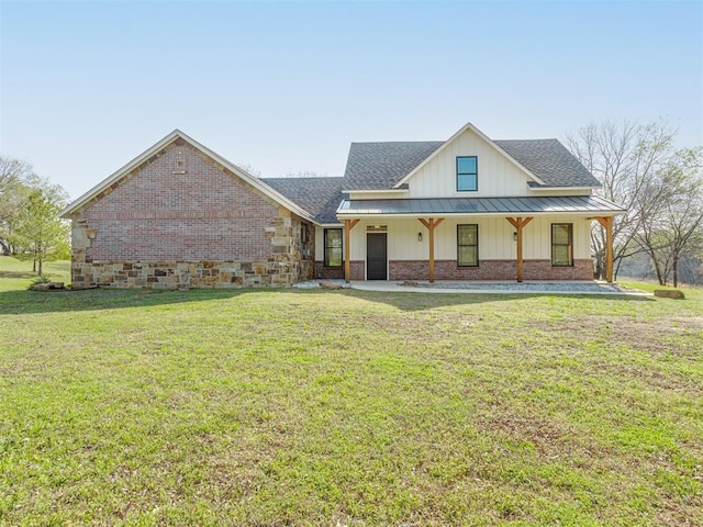 29490 County Road 180th Rd, Stillwater, OK 74075 - view of front of property featuring board and batten siding, a shingled roof, a front lawn, brick siding, and covered porch