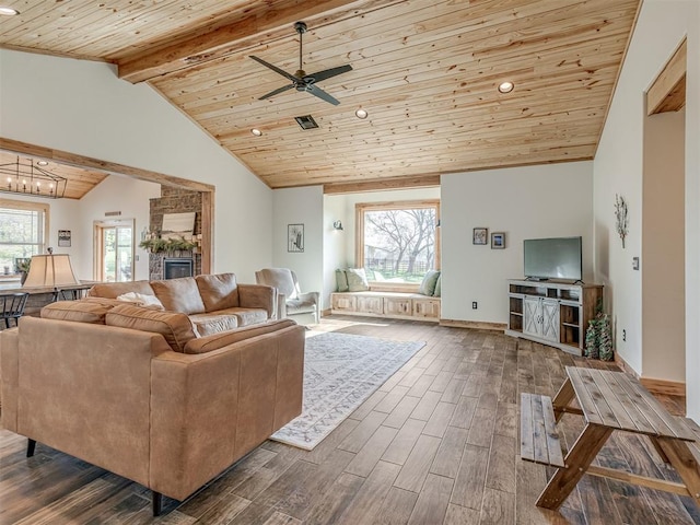 29490 County Road 180th Rd, Stillwater, OK 74075 - living room with wood ceiling, dark wood finished floors, a ceiling fan, a chandelier, and a stone fireplace