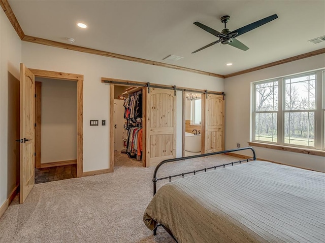 29490 County Road 180th Rd, Stillwater, OK 74075 - carpeted bedroom with crown molding, recessed lighting, a spacious closet, a barn door, and ceiling fan