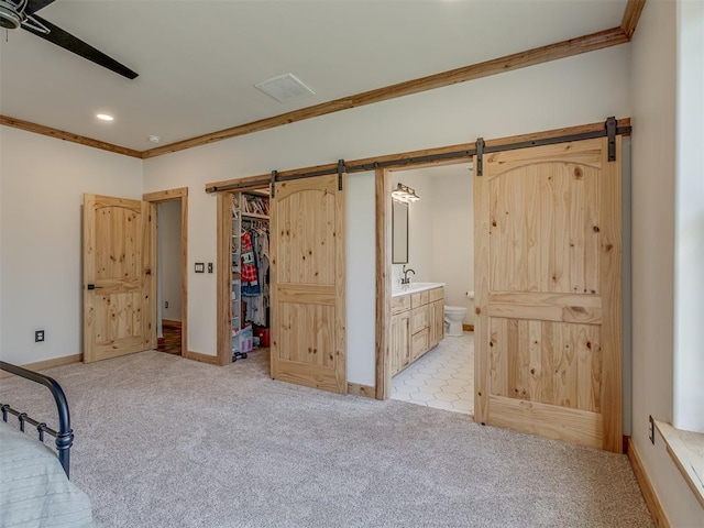 29490 County Road 180th Rd, Stillwater, OK 74075 - bedroom with a barn door, crown molding, light carpet, connected bathroom, and recessed lighting