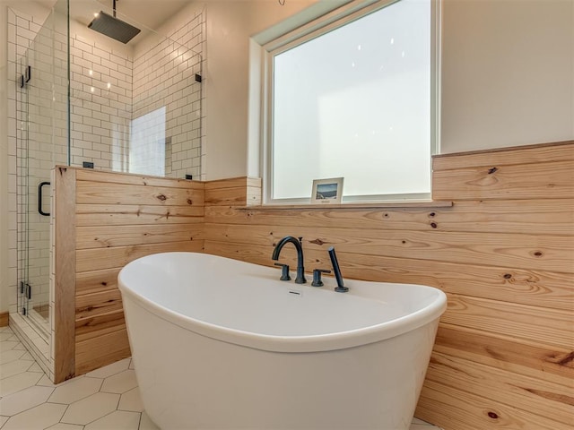 29490 County Road 180th Rd, Stillwater, OK 74075 - full bath featuring a stall shower, a freestanding bath, wainscoting, and tile patterned floors
