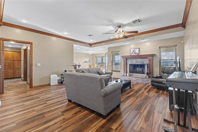 3008 Fairway Dr, Weatherford, OK 73096 - living room featuring wood finished floors, ceiling fan, ornamental molding, a fireplace, and recessed lighting