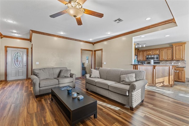 3008 Fairway Dr, Weatherford, OK 73096 - living area featuring ornamental molding, a ceiling fan, light wood finished floors, and recessed lighting