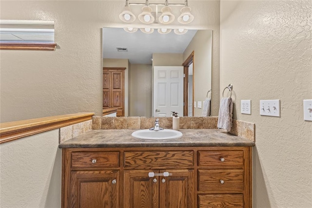 3008 Fairway Dr, Weatherford, OK 73096 - bathroom with a textured wall and vanity