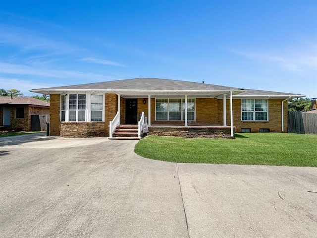 521 E Broadway St, Lexington, OK 73051 - single story home featuring a porch and brick siding