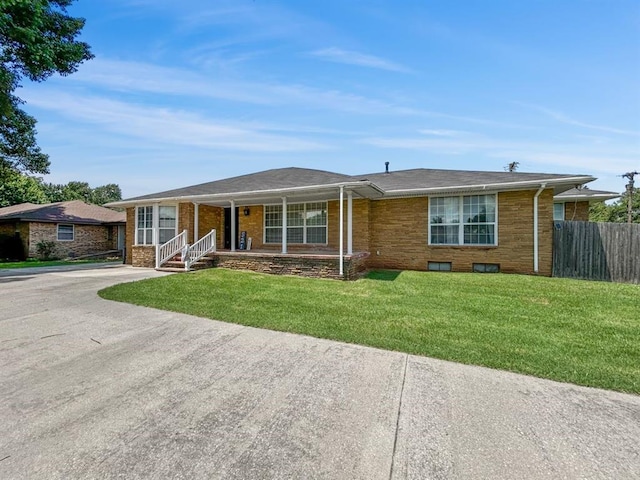 521 E Broadway St, Lexington, OK 73051 - ranch-style house featuring covered porch and brick siding