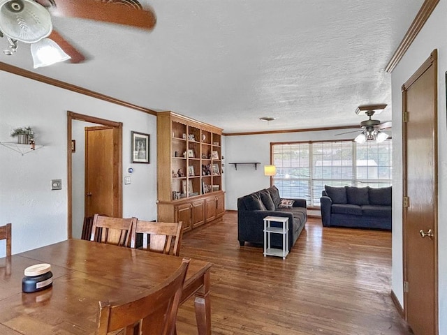 521 E Broadway St, Lexington, OK 73051 - dining space with ornamental molding, ceiling fan, wood finished floors, and a textured ceiling