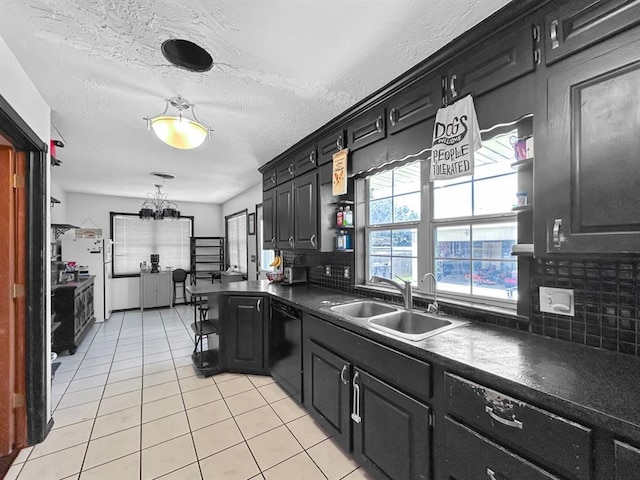 521 E Broadway St, Lexington, OK 73051 - kitchen with black dishwasher, dark countertops, tasteful backsplash, and healthy amount of natural light