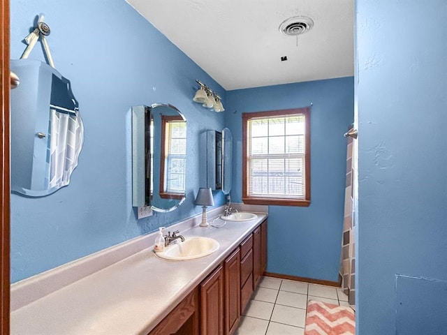 521 E Broadway St, Lexington, OK 73051 - full bath with double vanity, tile patterned floors, and a shower with shower curtain