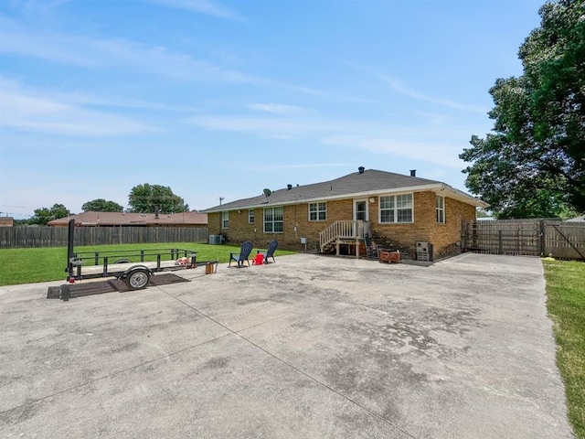 521 E Broadway St, Lexington, OK 73051 - back of house featuring brick siding and a patio area