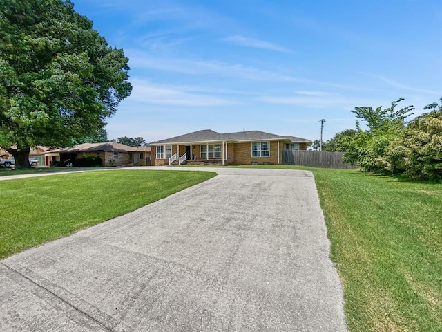 521 E Broadway St, Lexington, OK 73051 - single story home with asphalt driveway and brick siding