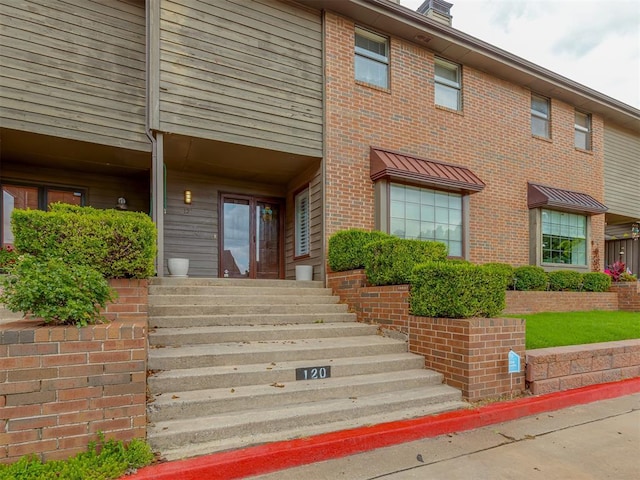 11300 N Pennsylvania Ave Unit 120, Oklahoma City, OK 73120 - property entrance featuring brick siding