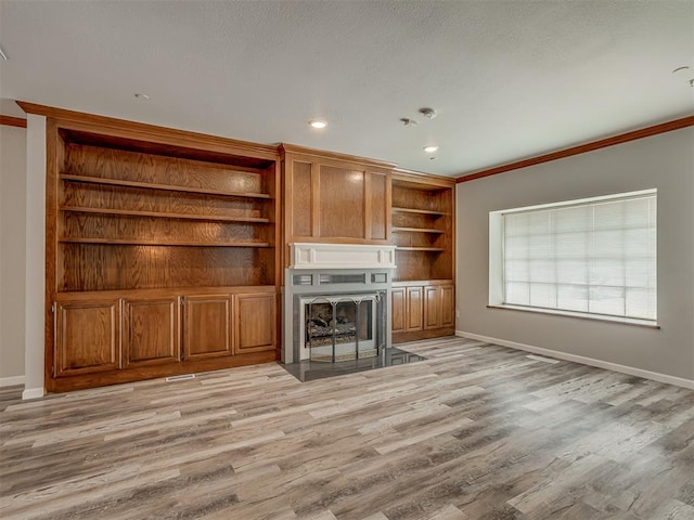 11300 N Pennsylvania Ave Unit 120, Oklahoma City, OK 73120 - unfurnished living room with a fireplace with flush hearth, light wood finished floors, crown molding, and recessed lighting
