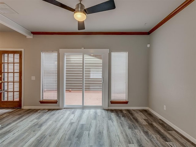 11300 N Pennsylvania Ave Unit 120, Oklahoma City, OK 73120 - unfurnished room featuring wood finished floors, ceiling fan, and ornamental molding