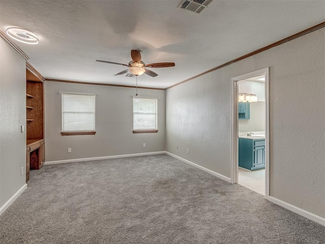 11300 N Pennsylvania Ave Unit 120, Oklahoma City, OK 73120 - spare room with ornamental molding, ceiling fan, carpet flooring, and a textured wall