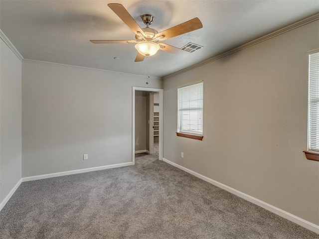 11300 N Pennsylvania Ave Unit 120, Oklahoma City, OK 73120 - empty room featuring crown molding, carpet flooring, and a ceiling fan