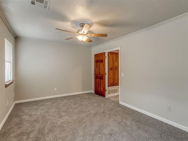 11300 N Pennsylvania Ave Unit 120, Oklahoma City, OK 73120 - empty room featuring a ceiling fan, carpet floors, and ornamental molding