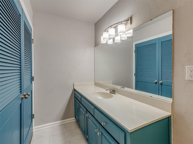 11300 N Pennsylvania Ave Unit 120, Oklahoma City, OK 73120 - bathroom featuring vanity, a closet, tile patterned floors, and a textured wall