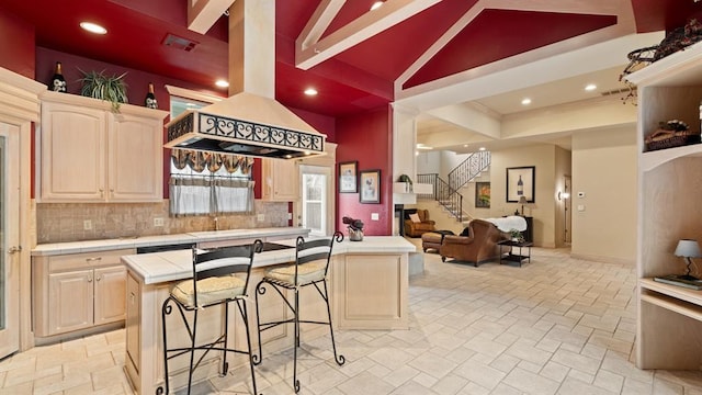704 Capri Pl, Edmond, OK 73034 - kitchen featuring tile countertops, light brown cabinets, island range hood, decorative backsplash, and recessed lighting