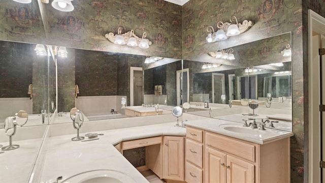 704 Capri Pl, Edmond, OK 73034 - bathroom featuring double vanity, a bath, and wallpapered walls