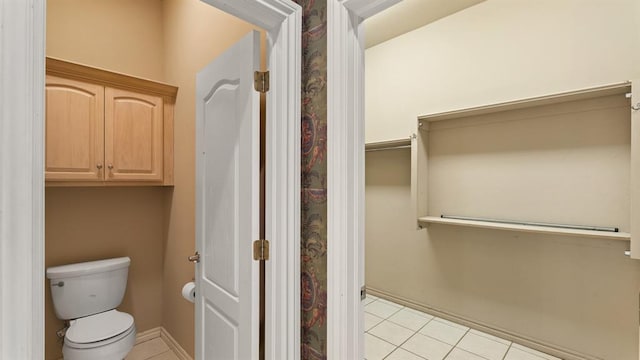 704 Capri Pl, Edmond, OK 73034 - bathroom featuring tile patterned floors and toilet