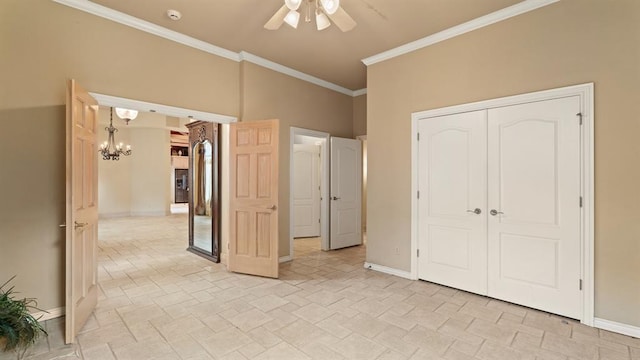704 Capri Pl, Edmond, OK 73034 - unfurnished bedroom featuring a chandelier, ornamental molding, a closet, ceiling fan, and light stone finish floors