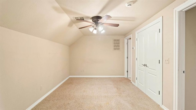 704 Capri Pl, Edmond, OK 73034 - additional living space with a ceiling fan, carpet floors, and vaulted ceiling