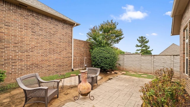 704 Capri Pl, Edmond, OK 73034 - fenced backyard with a patio area