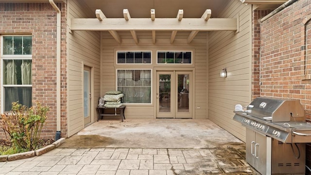 704 Capri Pl, Edmond, OK 73034 - view of patio / terrace featuring a grill and french doors