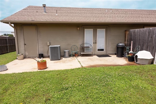 5712 NW 42nd Ter, Warr Acres, OK 73122 - back of house featuring a patio, roof with shingles, and french doors