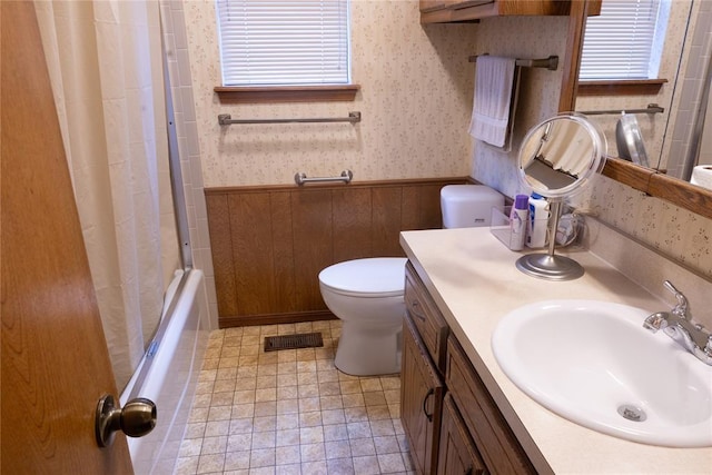 5712 NW 42nd Ter, Warr Acres, OK 73122 - bathroom featuring a wainscoted wall, vanity, and shower / bathtub combination with curtain