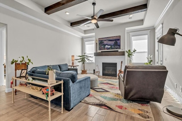2033 Marsala Dr, Edmond, OK 73034 - living room with beam ceiling, a glass covered fireplace, light wood-style floors, and ceiling fan