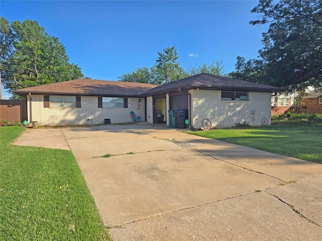 5712 Lawson Ln, Oklahoma City, OK 73132 - view of front of house with brick siding, a front yard, and driveway