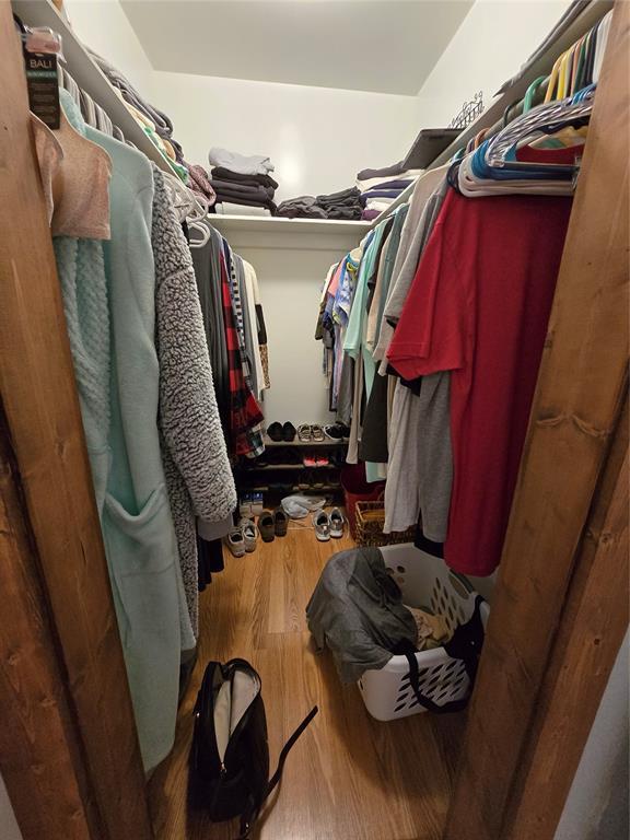 5712 Lawson Ln, Oklahoma City, OK 73132 - spacious closet featuring wood finished floors